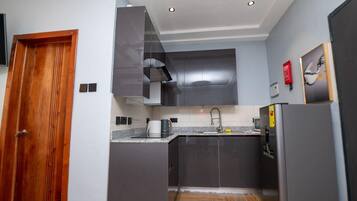 Fridge, microwave, stovetop, coffee/tea maker