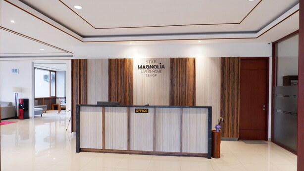 A reception area with a sign reading "Star Magnolia Living Home 'Senior'". - Nava Magnolia Hotel (Bandung)