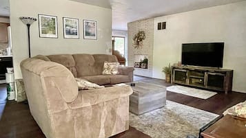 Smart TV, fireplace, books, printers