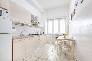 Fridge, microwave, stovetop, coffee/tea maker