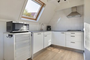 Fridge, microwave, stovetop, coffee/tea maker