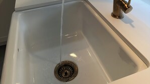 A kitchen sink with a modern faucet and a window above it. - Charming country home in beautiful Pt Grey Village. Close to Beach, UBC, DT.  (Vancouver)