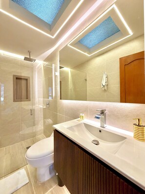 Shower, hair dryer, towels, soap