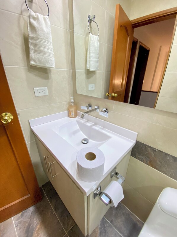 Shower, hair dryer, towels, soap