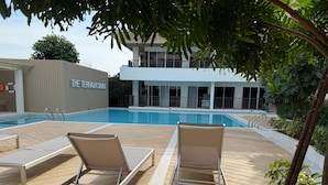 A poolside area with lounge chairs and a building labeled "The Terraza". - Amazing new 1-bedroom apartment, fabulous Lamai Beach,  swimming pool, fitness (Koh Samui)