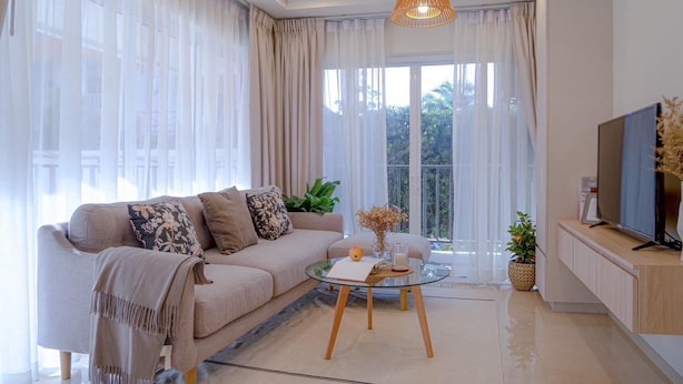 A modern living room with a sofa, a glass coffee table, and a TV. - Amazing new 1-bedroom apartment, fabulous Lamai Beach,  swimming pool, fitness (Koh Samui)