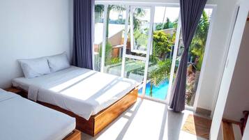 Comfort Triple Room, Non Smoking, Garden View | Desk, laptop workspace, blackout curtains, iron/ironing board