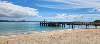 Elevated Coastal Retreat in Maraetai