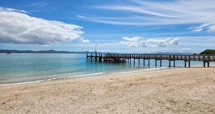 Elevated Coastal Retreat in Maraetai