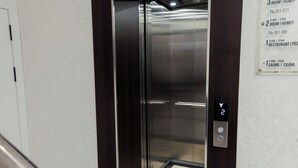 An elevator interior with a digital display showing floor 2. - Polar Bear (Samarkand)