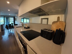 Private kitchen - City Retreat with Rooftop Pool, Private Parking & City Views (Reid)