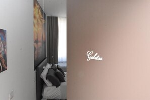 Habitació Comfort, vistes a la ciutat | Caixa forta a l'habitació i escriptori