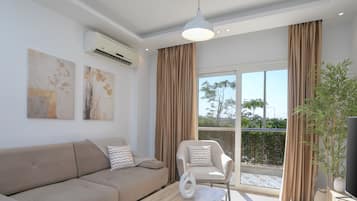 Classic Apartment | Living area | 50-inch flat-screen TV with premium channels