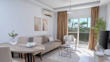 Classic Apartment | Living area | 50-inch flat-screen TV with premium channels