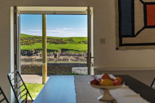 A pretty cottage by the sea, with uplifting views and lively Kinsale nearby.