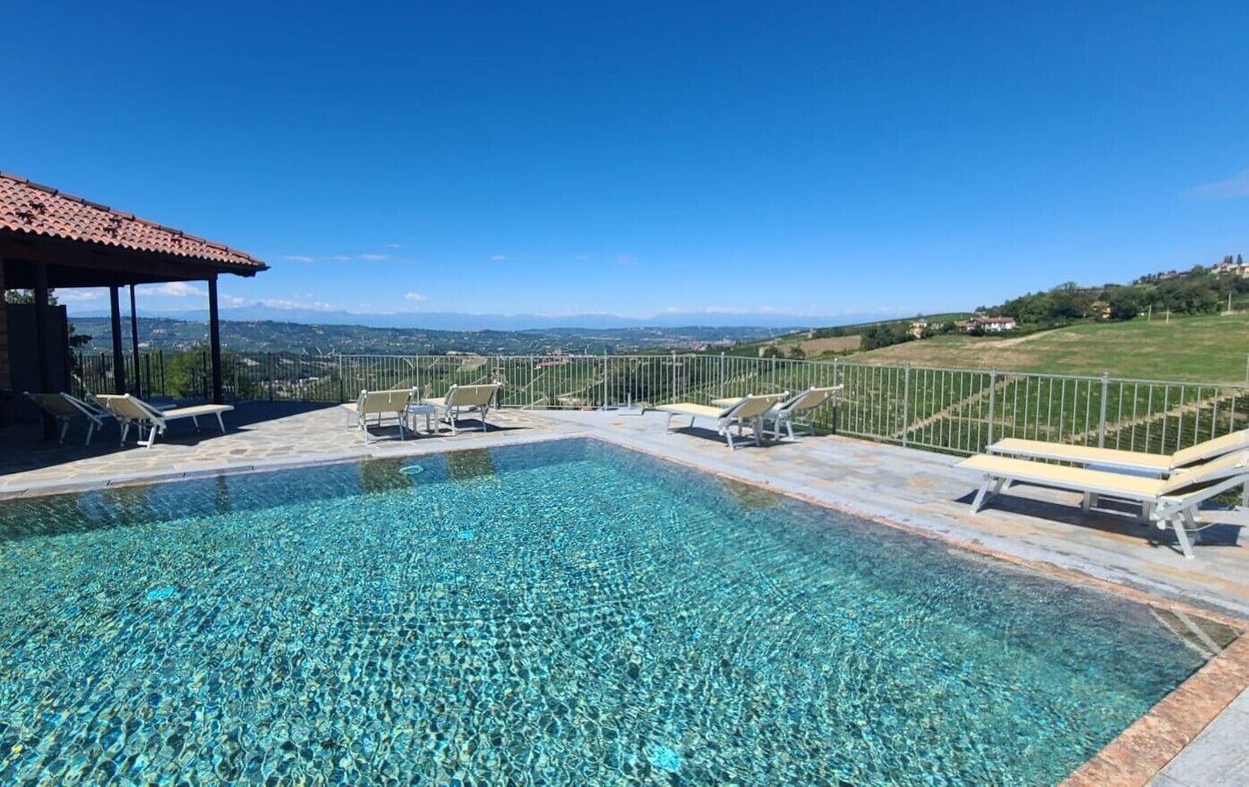 Seasonal outdoor pool, open 10:00 AM to 7:00 PM, pool umbrellas