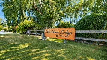 A wooden sign for Lake Tahoe Lodge by Ohana.