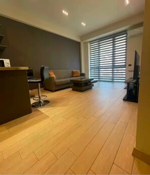 Signature Condo, Non Smoking, Balcony | Living room