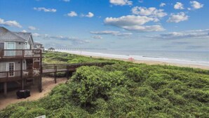 A beachfront property with a wooden deck and a view of the ocean. - Spendlove, Ships Watch Community in Duck, NC (Duck)