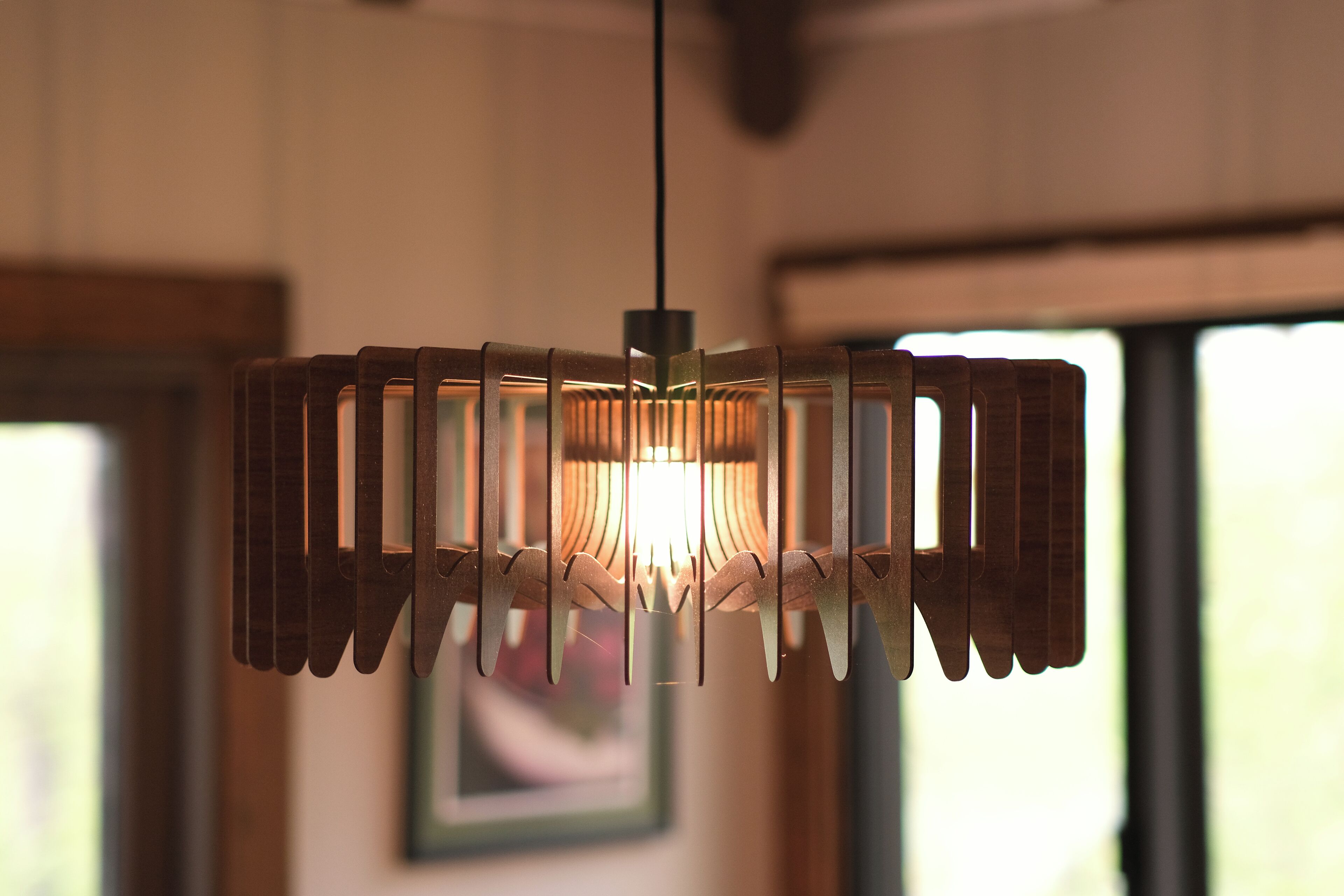 A pendant light fixture with a geometric design.