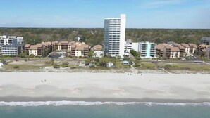 A coastal hotel with multiple buildings, a sandy beach, and ocean views. - Forest Dunes 207 -1BR -Pools, Hot Tub, Lazy River (Myrtle Beach)