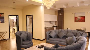 Luxury Suite, Balcony, City View | Living area | 43-inch flat-screen TV with cable channels, computer monitors, printers
