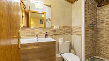 Shower, hair dryer, soap, toilet paper