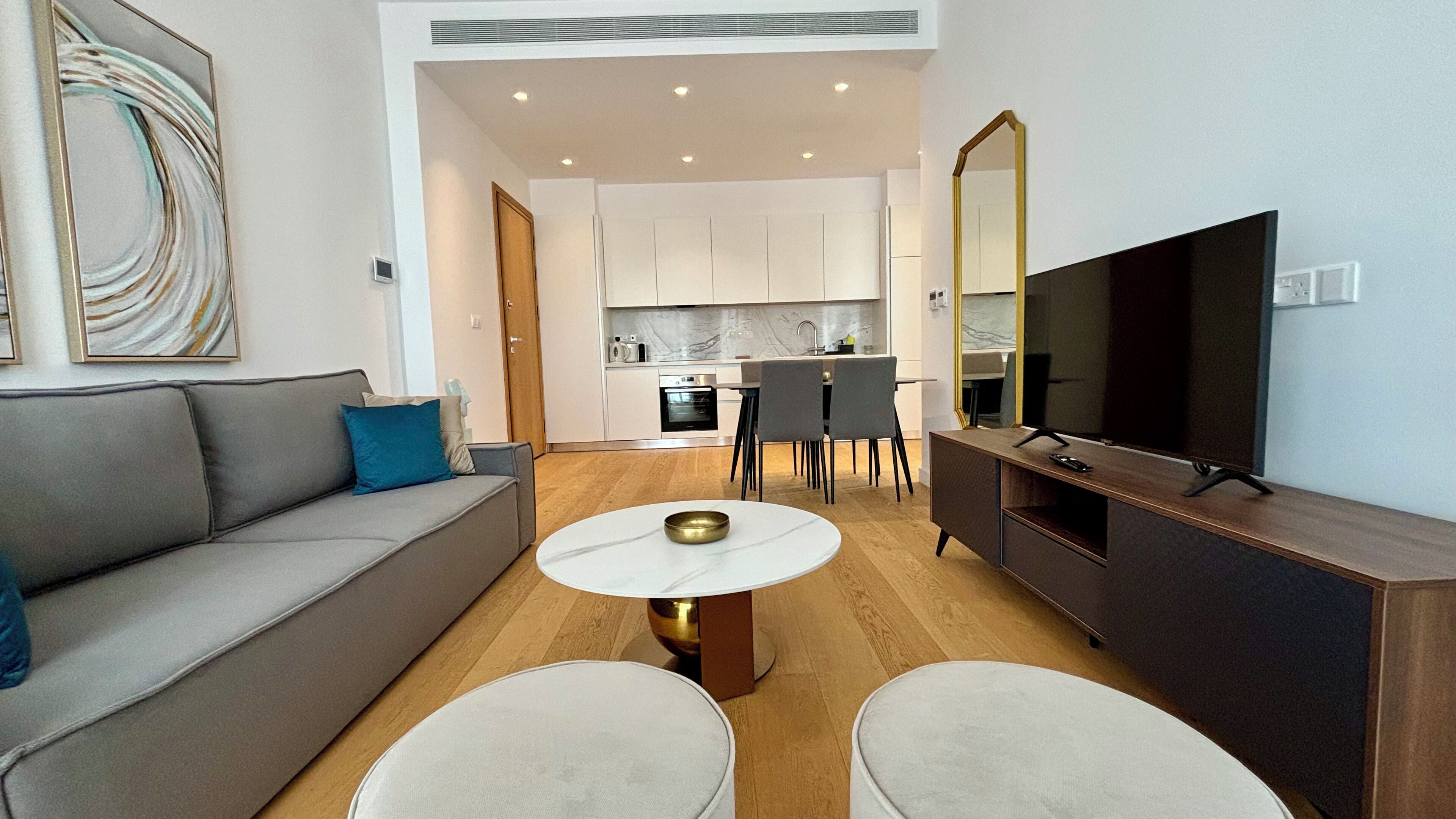 Departamento Deluxe, vista a la ciudad | Área de sala de estar