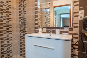 Shower, hair dryer, towels, soap