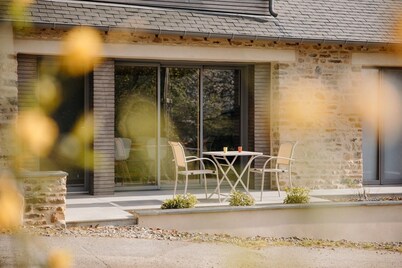 Renovated farmhouse with sauna, chalet atmosphere, in a quiet wooded setting.