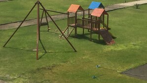 A playground with a swing set and a climbing structure. - House in front of the sea, with swimming pool, terrace, barbecue, Pet friendly! (Asia)