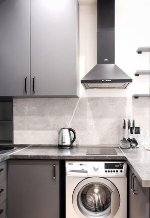 Fridge, microwave, stovetop, cookware/dishes/utensils