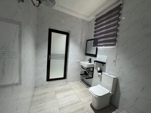 Shower, soap, toilet paper -
Opulent 3-bedroom home: master suites, study, balcony, HS WiFi, A/C & washer. (Accra)