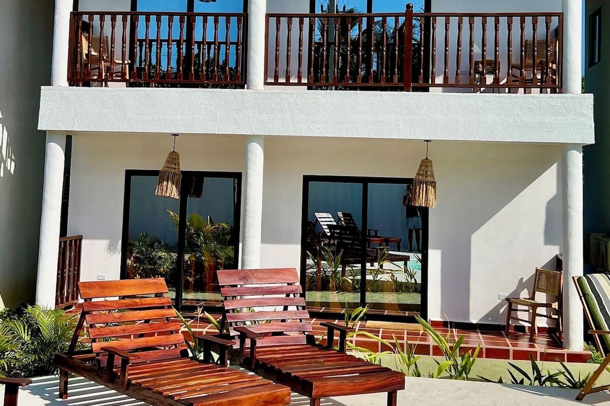 Deluxe Quadruple Room, Partial Sea View | Down duvets, free WiFi
