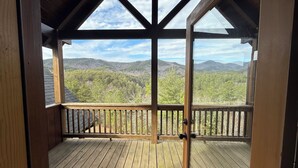 A wooden deck with a view of a forested mountain range. - Gorgeous Cabin Private Retreat on 15 acres (Copperhill)