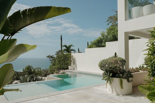 Dreamy King Bedroom Ocean view suite at Sky House Santa Teresa