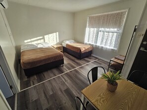 Deluxe Twin Room, Garden View | Blackout drapes, iron/ironing board, free WiFi