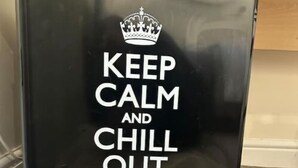 A black cabinet with a motivational message and a crown logo. - Newly Built Private Ensuite Room (Manchester)