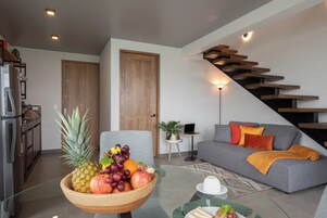 Deluxe House, 1 King Bed, Balcony, Partial Ocean View | Living area | 65-inch Smart TV with cable channels