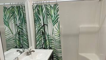 Shower, towels, soap, toilet paper