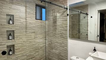 Shower, hair dryer, towels, soap