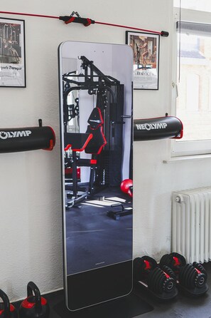 A gym with exercise equipment, dumbbells, and a large mirror. - 🎮Gamer's Lair🕹 incl. Extras (Göttingen)