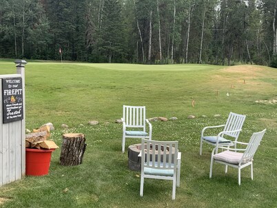 Candle Lake retreat backing the 5th green of the golf course.