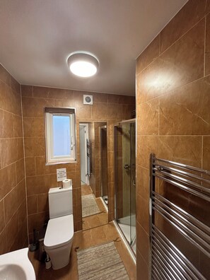 Shower, towels, soap, toilet paper