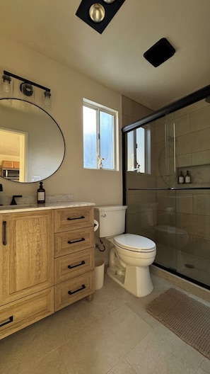 Shower, towels, soap, toilet paper