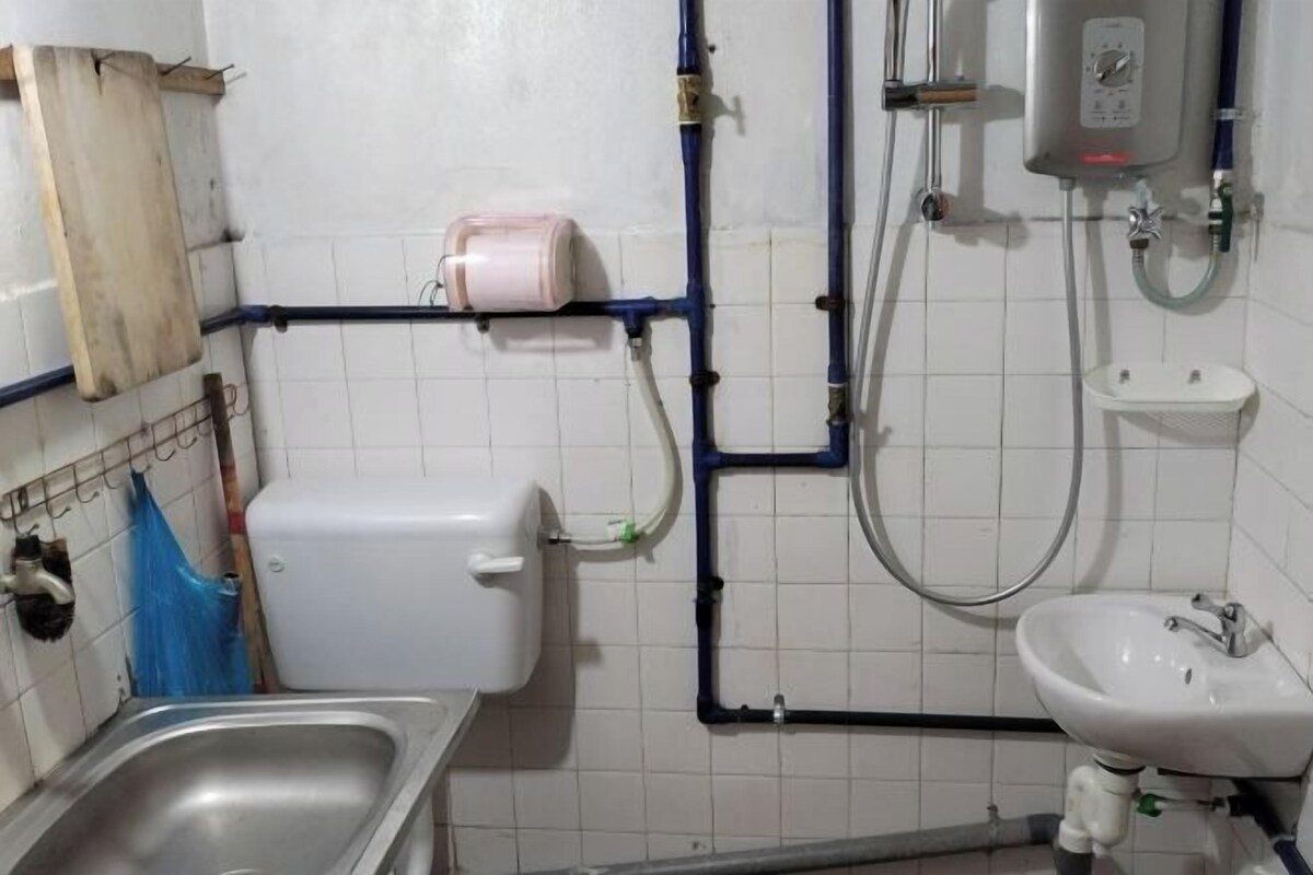 A bathroom with a sink, toilet, and shower.