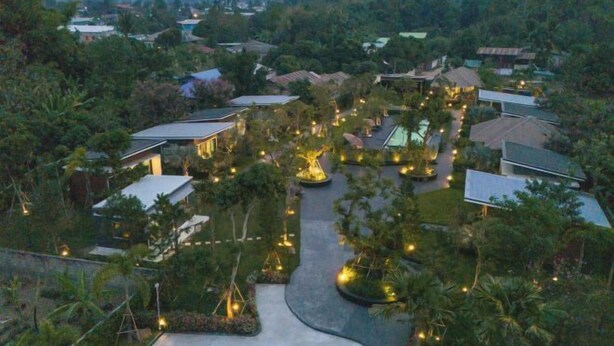 A residential area with houses, a winding road, and illuminated pathways. - Seeview Resort (Phetchabun)
