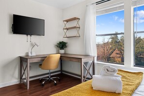 Enjoy a view of the city from the large window, relax on the comfortable bed, and stay entertained with the flat-screen TV.