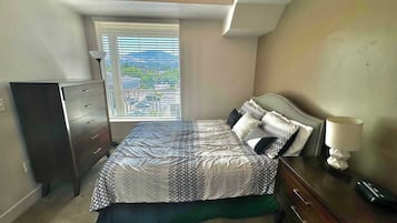 1 bedroom, desk, iron/ironing board, travel crib