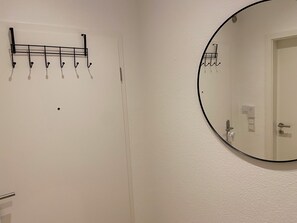 Shower, hair dryer, towels, toilet paper